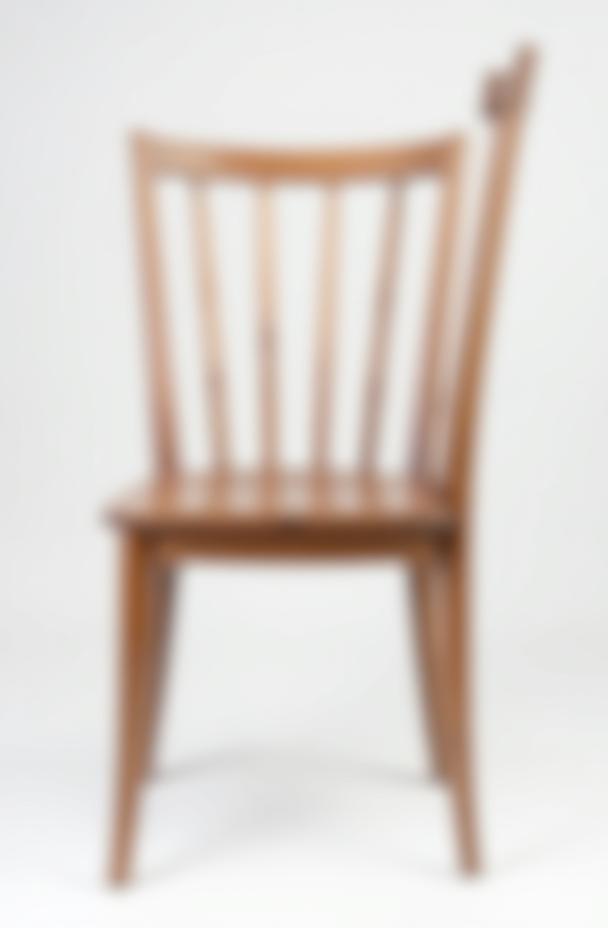 Classic wooden dining chair with a spindle back and comfortable seat